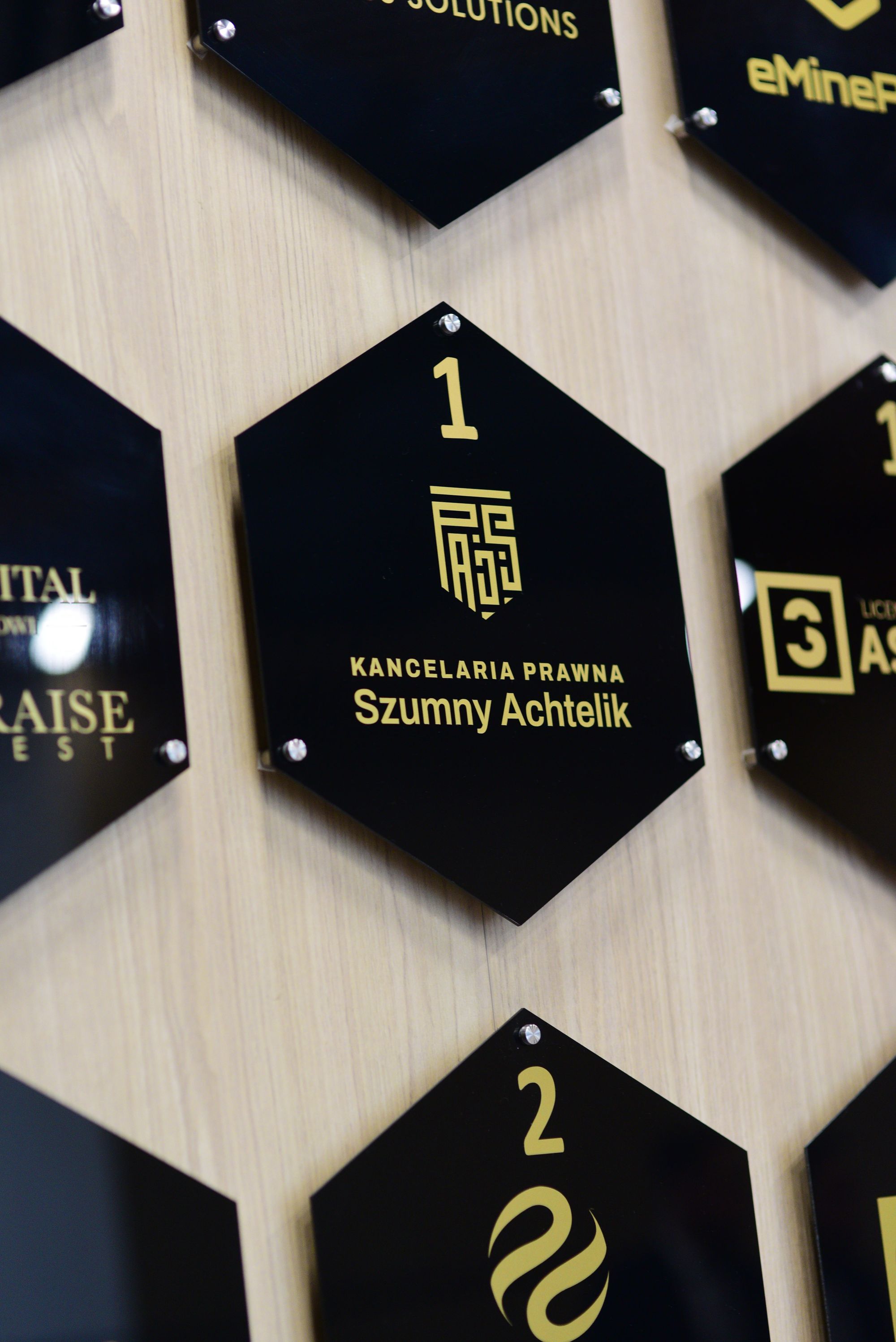 The law firm title tile on a wall